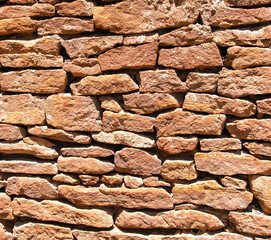 Ancient stone bricks in the wall as a background. Texture