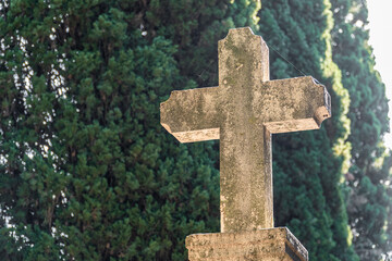 Old stone cross outdoors in the cemetery