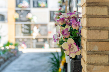 Flowers on the tombstones in the cemetery.