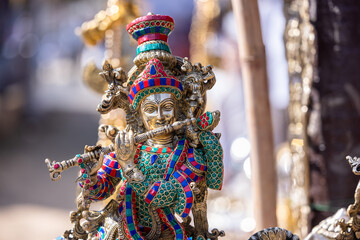 Brass metal art, Handmade Indian cultural and hindu god sculpture souvenir made with brass with plain background. Selective focus.