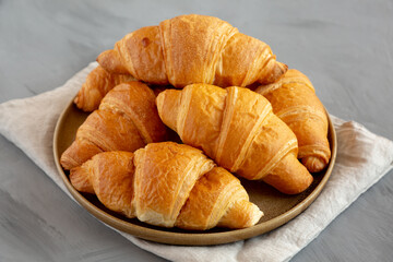 Homemade Croissants on a Plate, side view.