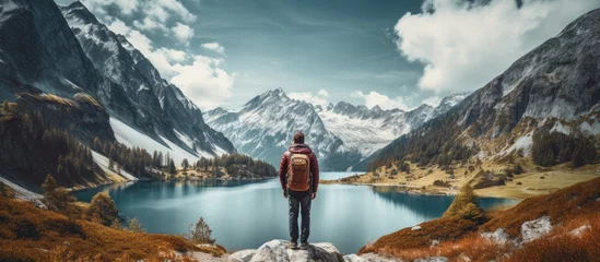 Foto op Canvas Hikers admire lake in mountains With copyspace for text © 2rogan