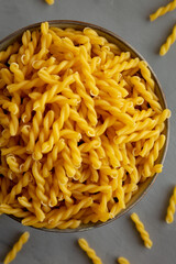 Uncooked Dry Gemelli Pasta in a Bowl, top view. Flat lay, overhead, from above.