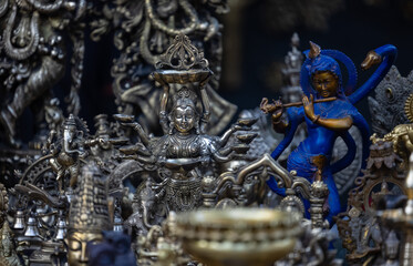 Brass metal art, Handmade Indian cultural sculpture souvenir made with brass with plain background. Selective focus.
