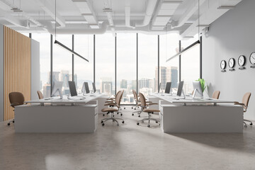 Gray and wooden open space office with clocks - obrazy, fototapety, plakaty