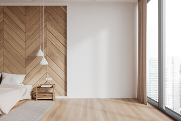White and wooden bedroom interior with blank wall