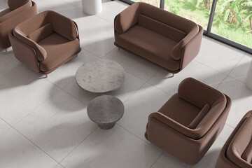 Top view of elegant hotel interior with waiting corner near panoramic window