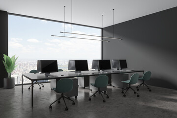 Grey coworking interior with desk and chairs in row, pc computer and window