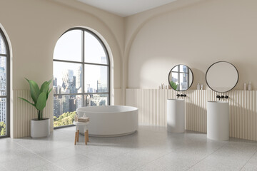 Beige bathroom corner with tub and double sink