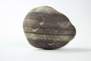 A closeup shot of a stone isolated on a white studio background