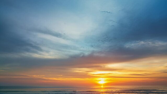 ..golden sky in sunset above the ocean Nature video High quality footage. .Scene of romantic sky sunset with orange color of the sky background. .timelapse day to night in nature and travel concept.