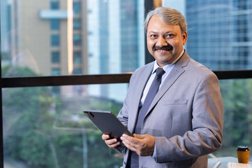 Businessman using digital tablet at office