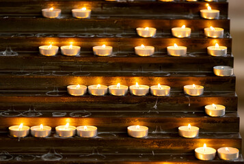 burning candles in a catholic church