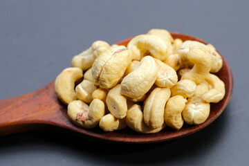 Cashew nuts on dark background.