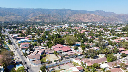 Aerial drone view of Dili capital city in East Timor, Southeast Asia with rugged hills in the distance