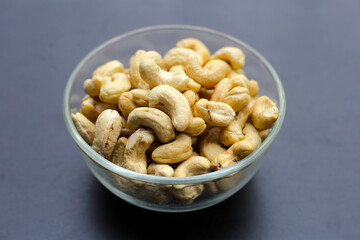 Cashew nuts on dark background.