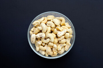 Cashew nuts on dark background.