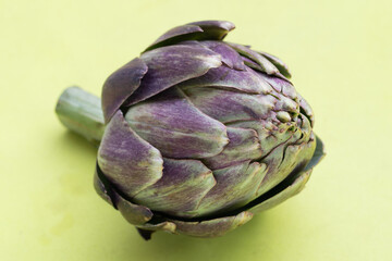 Obraz premium Fresh artichoke on green background.