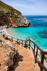 Stairs to the Beach Zingaro Nature Reserve Sicily Turquoise Sea Water Private Beach - obrazy, fototapety, plakaty