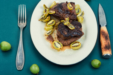 Grilled ostrich steak with kiwi sauce