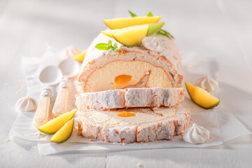 Homemade mango swiss roulade served as spring dessert.