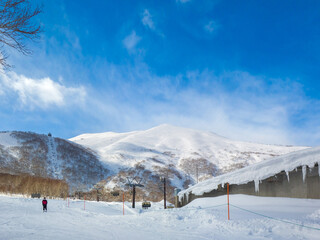 Looking up from a ski resort hillside to the summit (Niseko, Hokkaido, Japan)