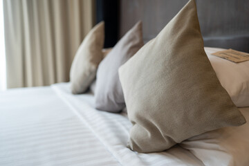 Fototapeta na wymiar Soft pillows on a bed, Comfortable cushion for sleep.