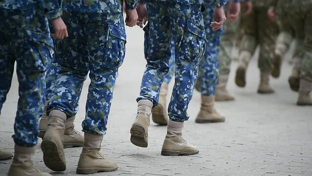 Soldiers in marching formation during military recruitment 