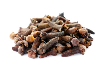 Pile of dry spice cloves isolated on white background, top view. Dry clove spices on a white background. Heap of aromatic clove spices close up, macro.