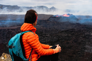 Traveler women near volcano in Iceland in 2023. Travel extreme concept. Hiking in Iceland. Girl...