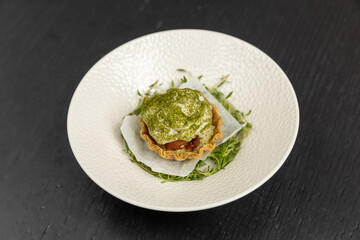 Pistachio dessert served on a white plate