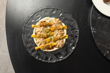 Hazelnut dessert served on a glass plate