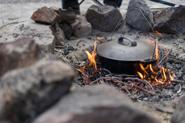 Cast iron camping oven cooking dinner in the Victorian bush in Australia
