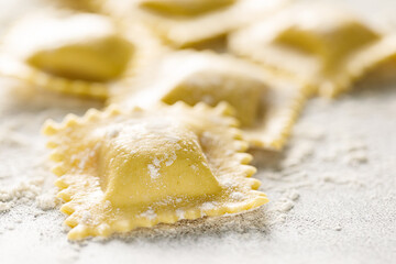 Cooking ravioli on a floured kitchen table