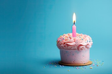 Pink cake with a candle on a blue background