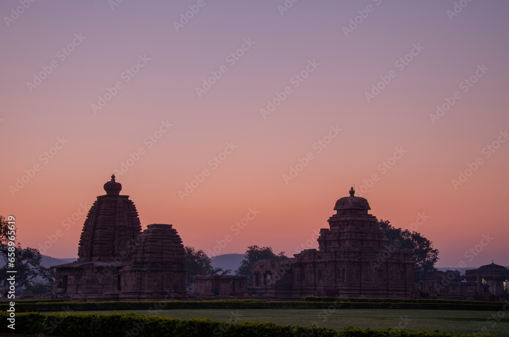 Wall mural badami temples during sunrise, badami, karnataka, india.