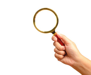 Close-up of hand holding a magnifying glass against a transparent background.
