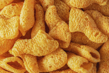 Ham flavored crisp snacks as background close-up