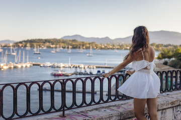 Greek Island Dream: Woman Enjoying the Corfu Harbor View