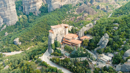 Fototapeta na wymiar Meteora, Kalabaka, Greece. Holy Monastery of Rousanos - Saint Barbara. Meteora - rocks, up to 600 meters high. There are 6 active Greek Orthodox monasteries listed on the UNESCO list, Aerial View