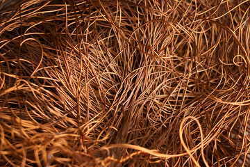 Stack scrap copper wire close up. Industrial electician background, wallpaper. Color metal....