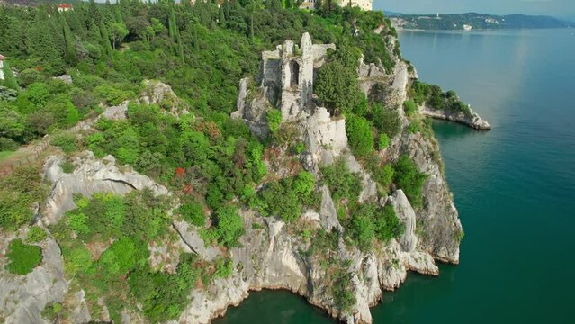 Old Castle of Duino on the high cliff over Mediterranean sea Trieste bay, Italy.