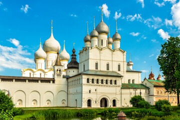 Fototapeta na wymiar Inner lord's courtyard in the Kremlin of Rostov the Great with a view of the Resurrection Church and the domes of the Assumption Cathedral