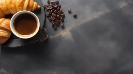 Foto auf Leinwand Croissant, mug of coffee and and coffee beans on a black stone table, top view, copy space on the right © CFK
