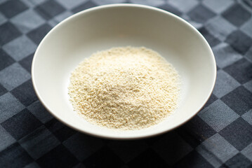 Breadcrumbs in a plate on a dark background