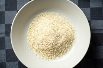 Breadcrumbs in a white plate. Top view