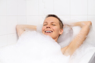 Mature woman enjoying a soothing bubble bath