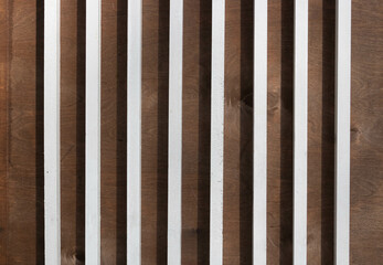 Background white wooden picket fences on a brown background