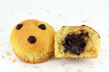 Delicious muffins with chocolate chips and hazelnut chocolate filling, white background