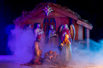 Christmas birth of Jesus. A Christmas scene with baby Jesus, Mary and Joseph in the manger....